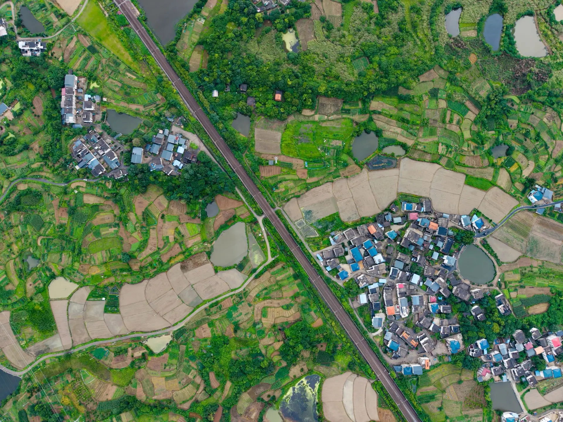 Aerial view of a rural landscape of fields, water and settlement