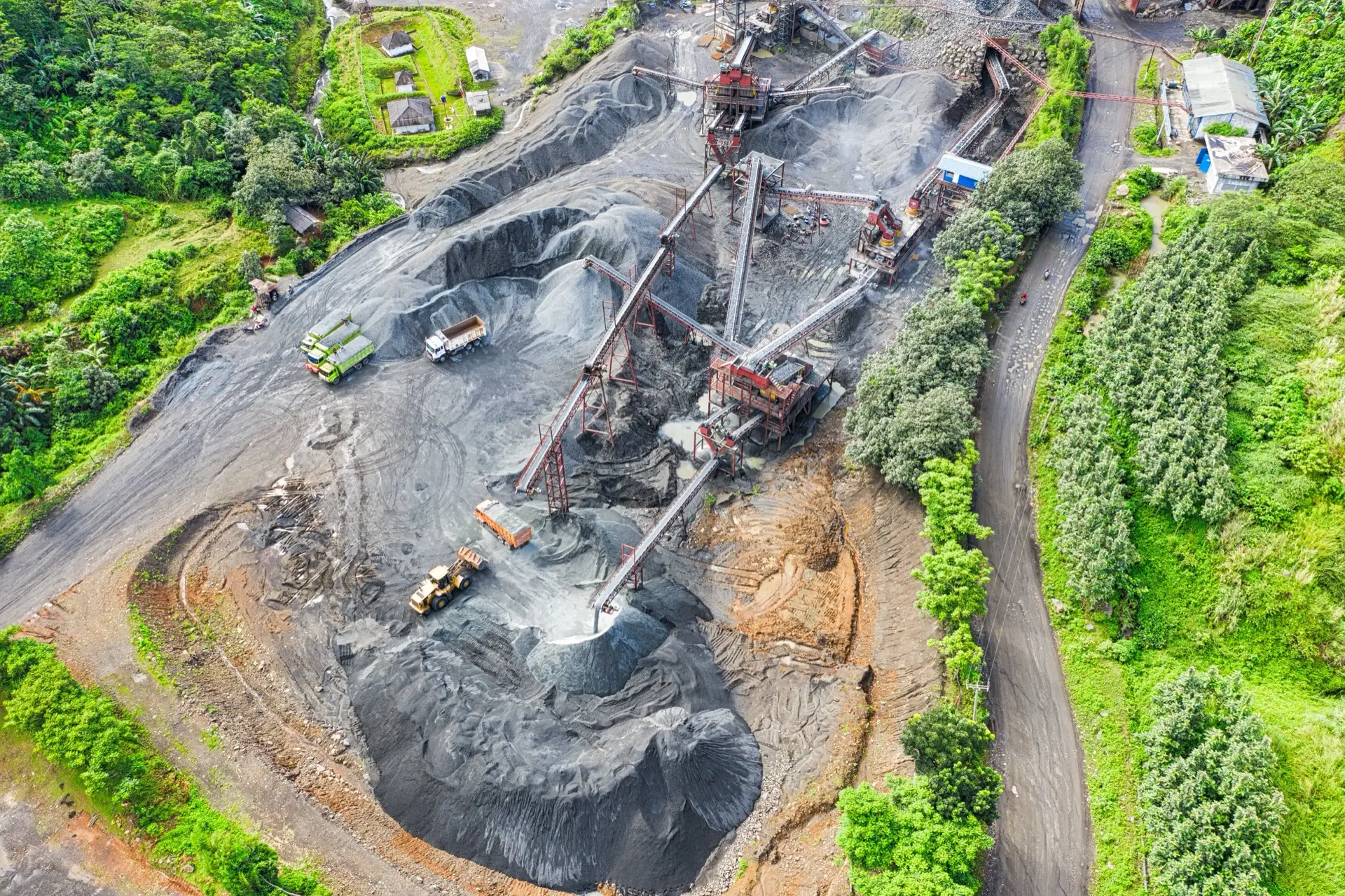 Aerial view of a quarry surrounded by green vegetation